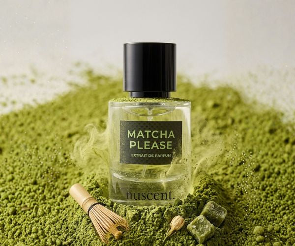 Matcha Please Extrait de Parfum bottle displayed on vibrant green matcha powder with traditional bamboo whisk and botanical elements representing zen tea ceremony ritual fragrance