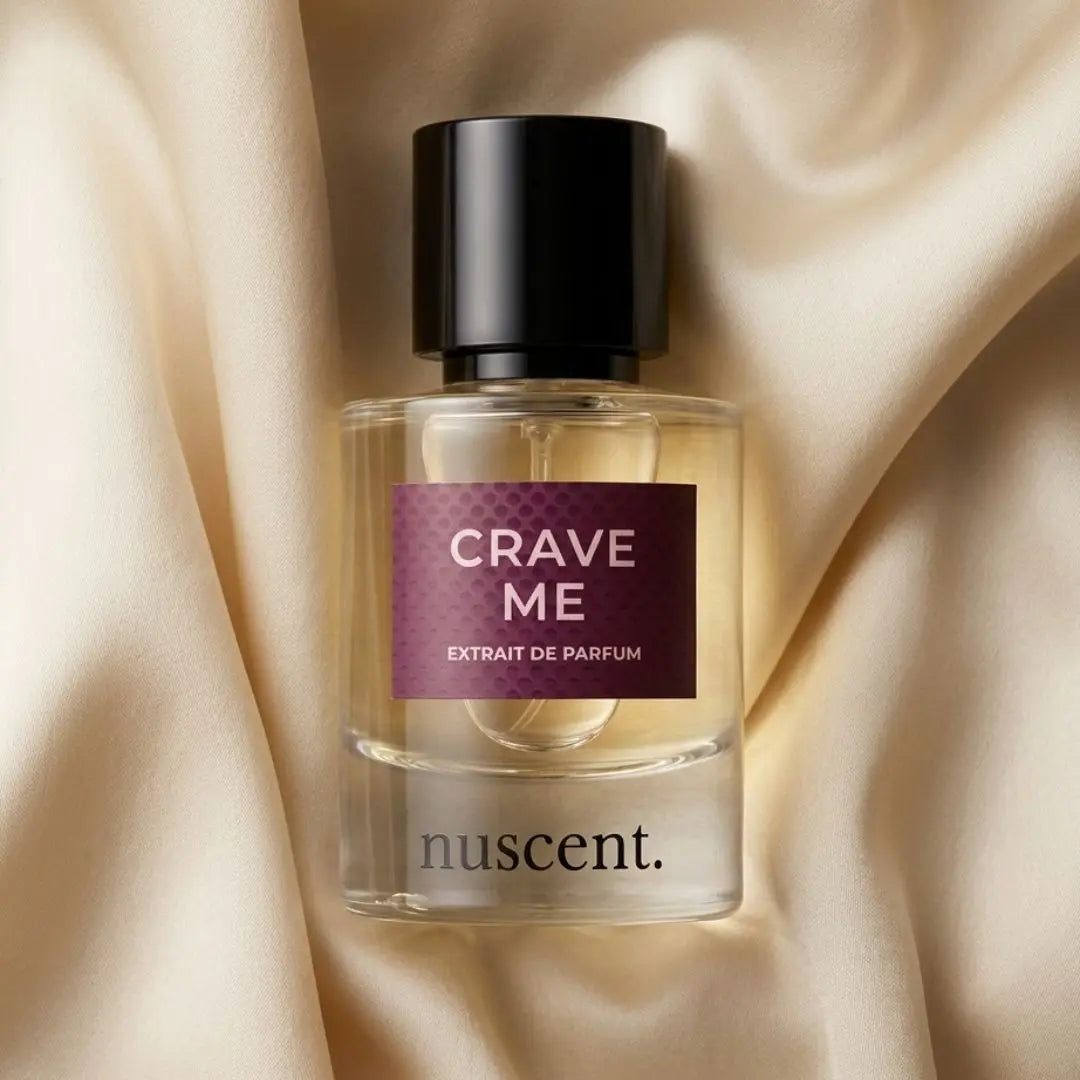 Crave Me Extrait de Parfum bottle on cream colored fabric background showcasing elegant minimalist luxury fragrance design